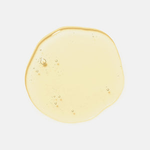 Clear, pale yellow serum drop with small bubbles, showcasing the texture of Moisture Reset | HydroPeptide skincare product.