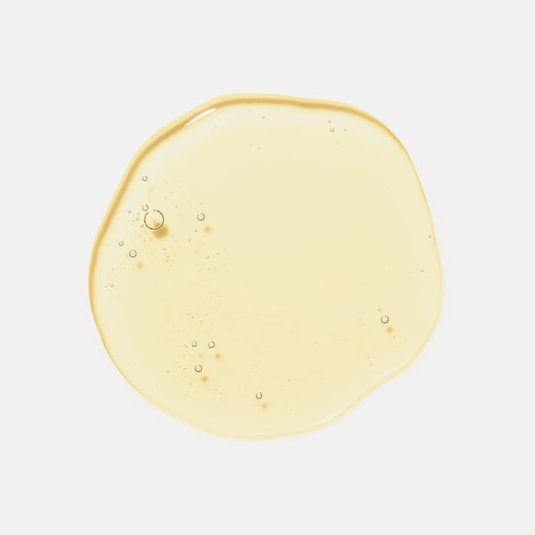 Clear, pale yellow serum drop with small bubbles, showcasing the texture of Moisture Reset | HydroPeptide skincare product.