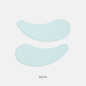 Pair of light blue curved eye masks displayed on a white background designed for skincare use with PolyPeptide Collagel+ Eye Mask | HydroPeptide.