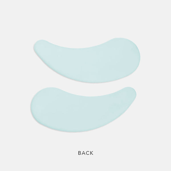 Pair of light blue curved eye masks displayed on a white background designed for skincare use with PolyPeptide Collagel+ Eye Mask | HydroPeptide.