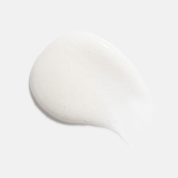 White creamy foam texture of Foaming Cream Cleanser | HydroPeptide displayed on a light background, highlighting its smooth and gentle skincare formula.