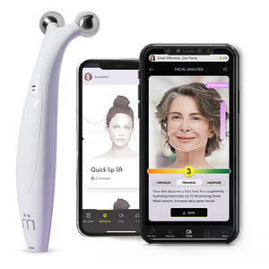 Myolift QT Plus Premium - Lifetime Membership | 7e Wellness device with dual metal spheres next to two smartphones showing facial analysis and skincare session apps for wrinkle reduction and firmness improvement.