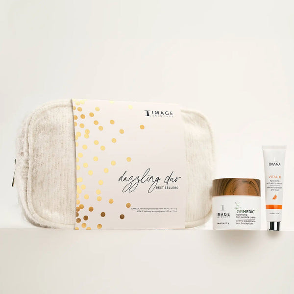 Dazzling Duo | IMAGE Skincare set featuring Ormedic balancing bio-cellulose cream, Vital C hydrating enzymatic cream, and a textured beige cosmetic pouch with gold accents.