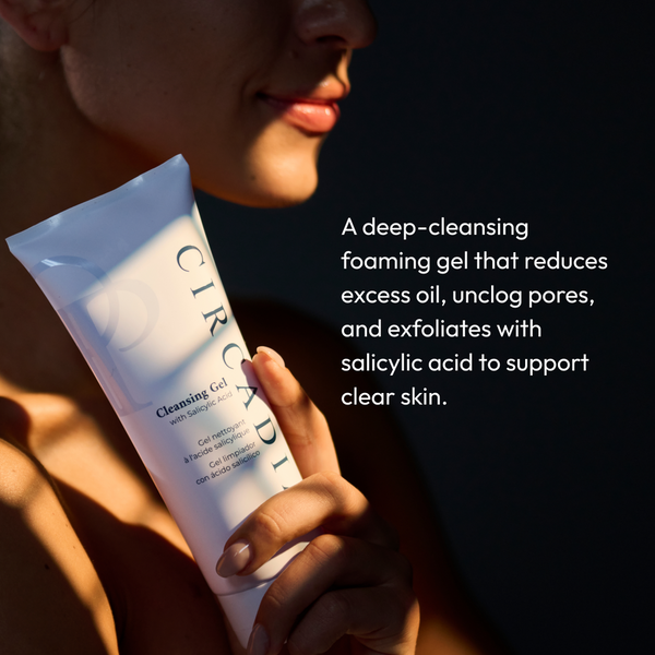Woman holding a tube of Cleansing Gel with Salicylic Acid | Circadia with text describing its deep-cleansing, exfoliating properties that reduce excess oil and unclog pores for clearer skin.