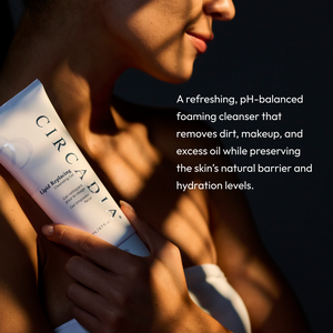 Woman holding a tube of Lipid Replacing Cleansing Gel | Circadia in soft sunlight with text describing it as a pH-balanced foaming cleanser that removes dirt, makeup, and excess oil while preserving skin’s natural barrier and hydration.