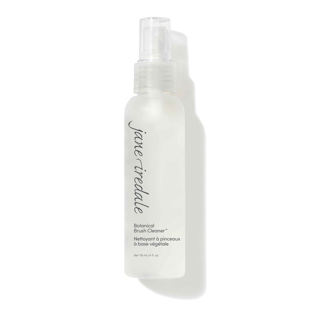 White spray bottle of Botanical Brush Cleaner™ | Jane Iredale with light blue logo and text highlighting seaweed conditioners and grapefruit extract for brush cleansing and skincare maintenance.