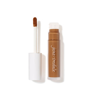 Open tube of PureMatch Liquid Concealer | Jane Iredale in a warm soldier shade with visible applicator wand showing creamy brown concealer on the tip.