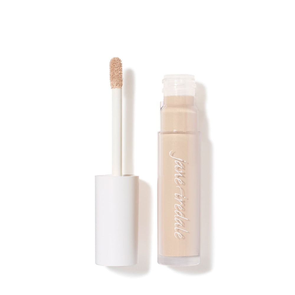 Open tube of PureMatch Liquid Concealer | Jane Iredale with visible beige liquid concealer and applicator wand on a white background, showcasing skincare makeup product.