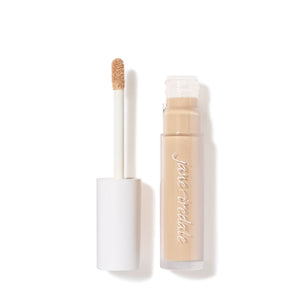 Open tube of PureMatch Liquid Concealer | Jane Iredale with beige liquid concealer visible on the applicator wand and inside the clear container.