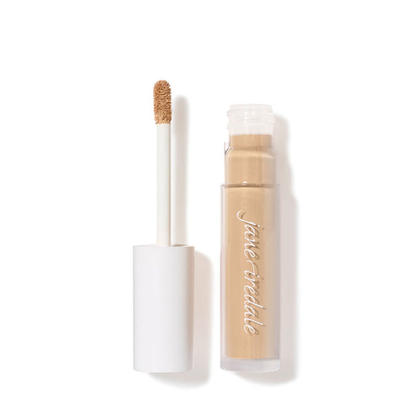Open tube of PureMatch Liquid Concealer | Jane Iredale with a white cap and applicator wand showing natural beige liquid concealer inside against a white background.