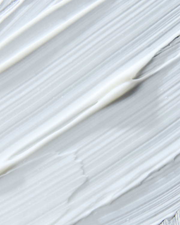 Close-up texture of smooth white cream representing EyeHero™ Bio-Retinol Smoothing Eye Cream | Three Ships for skincare and gentle eye care.