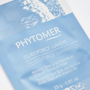 Close-up of the Oligoforce Lumination Targeted Dark Spot and Wrinkle Sheet Mask With Vitamin B3 - 4 Mask Set| Phytomer packaging, highlighting the skincare product details for targeted dark spots and wrinkles.