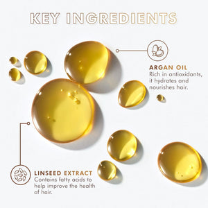 Close-up of golden oil droplets on a white surface highlighting argan oil and linseed extract as key ingredients for hair hydration and nourishment in Moroccanoil Treatment | Moroccanoil.