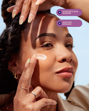 Woman with braided hair applying Replenish Ceramides + Blueberry Barrier Repair Serum | Three Ships to her cheek, highlighting benefits that support skin barrier and soothe redness.