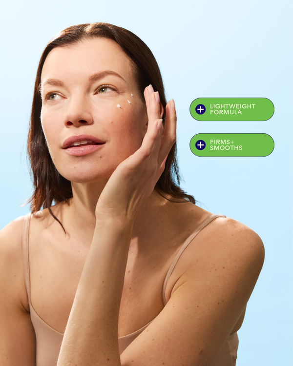 Woman with fair skin applying EyeHero™ Bio-Retinol Smoothing Eye Cream | Three Ships to her under-eye area, highlighting lightweight formula and firming, smoothing benefits for skincare.