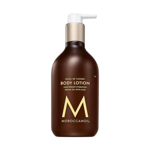 Pump bottle of Body Lotion | Moroccanoil in dark amber with gold and white accents, featuring lightweight hydration with argan oil and aloe for skincare and body care wellness.
