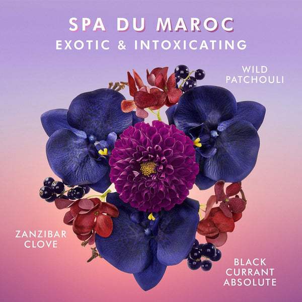 Floral arrangement featuring deep purple orchids, a vibrant magenta flower, red blossoms, and berries highlighting exotic scents of wild patchouli, Zanzibar clove, and black currant absolute for Shower Gel | Moroccanoil.