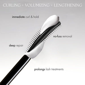 Close-up of a beauty applicator brush coated with white cream, illustrating benefits of Curling TUBING™ Primer | Blinc for curling, volumizing, lengthening lashes, providing immediate curl and hold, deep repair, no-fuss removal, and prolonged lash treatments.