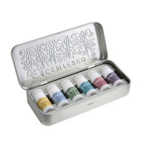 Wellbeing Ritual Aromatherapy Mini Tin | Scentered featuring six small bottles in a silver embossed metal tin, designed for wellness and relaxation through aromatherapy.