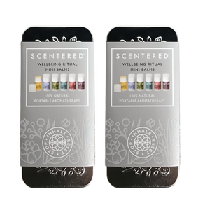 Two closed metal tins labeled Wellbeing Ritual Aromatherapy Mini Tin | Scentered featuring portable natural aromatherapy balm products in pastel colors, designed for wellness and skincare.