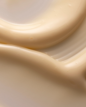 Close-up of smooth, creamy beige skincare serum texture representing SkinHero™ Calendula + 2% Bakuchiol Bio-Retinol Serum | Three Ships for skincare and wellness.