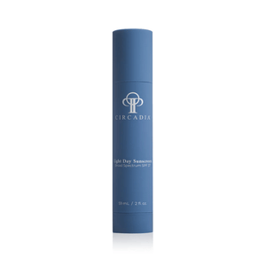 Blue cylindrical container of Light Day Sunscreen Broad Spectrum SPF 37 | Circadia, designed for skincare and sun protection.