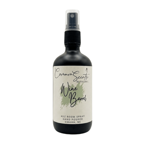 4oz Luxury Room Spray | CommonScents by Tayler E featuring a sleek black bottle with a spray nozzle and a minimalist label for a sophisticated wine barrel scent.