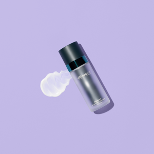 Day Serum | Althaea Skin bottle with a smooth white serum texture spread beside it on a purple background, showcasing skincare product designed for daily use.
