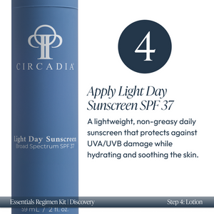 Close-up of a blue bottle of Light Day Sunscreen SPF 37 from the Discovery Essentials Kit | Circadia, highlighting its lightweight, non-greasy formula that protects and hydrates skin.