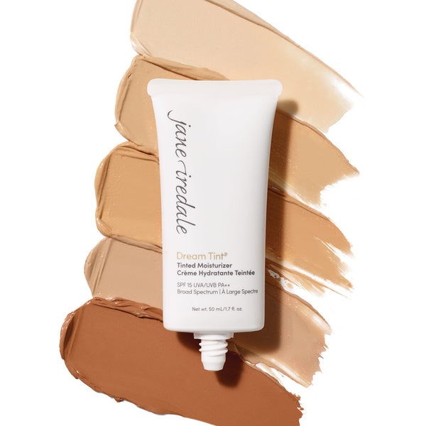 Dream Tine Tinted Moisturizer SPF 15 | Jane Iredale tube displayed on three swatches of tinted moisturizer shades, showcasing natural skincare and sun protection.