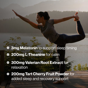 Woman practicing yoga outdoors near a lake at sunrise, showcasing wellness and relaxation benefits associated with Elite Sleep, including melatonin, L-Theanine, valerian root extract, and tart cherry fruit powder.