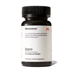 Dark amber bottle of Iron+ dietary supplement with Vitamin B Complex for foundational health and energy support, featuring a black ribbed cap.