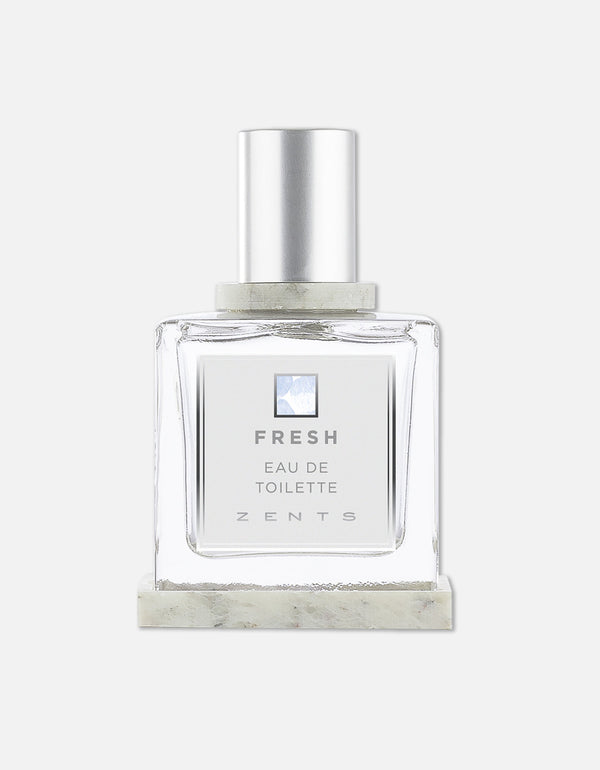 Clear glass bottle of Eau de Toilette | Zents with silver cap and minimalist label reading Fresh, designed for a clean and crisp fragrance experience.