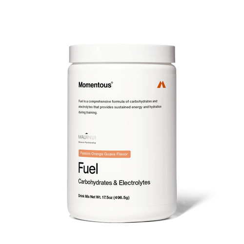 White container of Fuel drink mix with passion orange guava flavor, labeled for carbohydrates and electrolytes to support sustained energy and hydration during training