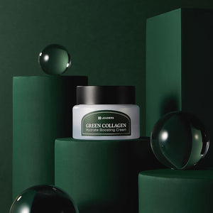 Jar of Green Collagen Firming Hydrate Boosting Cream | Leaders displayed on dark green cylindrical platforms with reflective glass spheres, evoking a sleek skincare aesthetic.