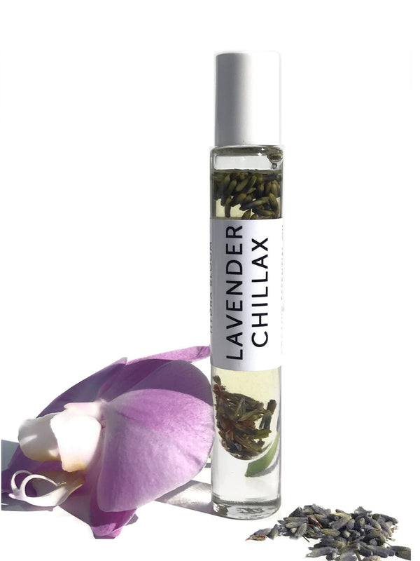 Lavender Chillax Organic Perfume Roll-on | Hydra Bloom in a clear glass bottle with lavender buds inside, displayed alongside a purple flower and dried lavender petals for wellness and skincare.