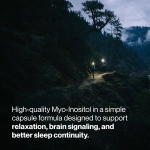 Two hikers with headlamps walking along a forest trail at dusk, illustrating the calming and sleep-supporting benefits of Inositol supplements.