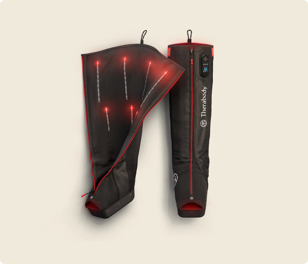 JetBoots PRO Plus | Therabody shown with one boot open to display inner LED therapy lights designed for recovery and wellness enhancement.