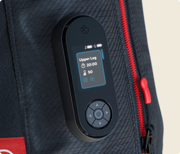 Close-up of the control panel on the JetBoots PRO Plus | Therabody, showing an active recovery session set to upper leg mode with temperature and time settings on a textured black fabric background.