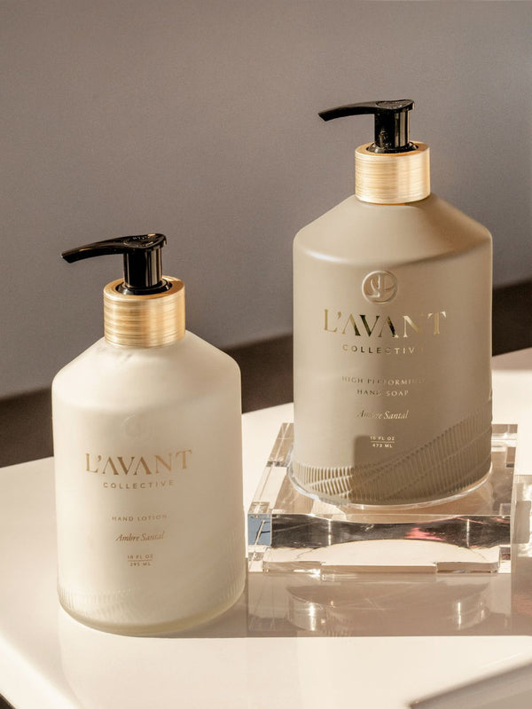 L'AVANT Collective Hand Soap Ambre Santal in glass bottle with brushed gold pump