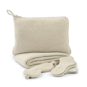 Travel Set (Blanket, Socks, Eyemask, Bag) | Kashwére in soft beige fabric, featuring a cozy blanket, matching socks, an eyemask, and a pouch for wellness and comfort.