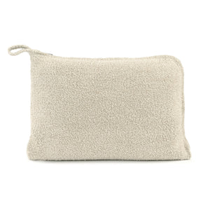 Soft beige textured pouch with a loop handle, part of the Travel Set (Blanket, Socks, Eyemask, Bag) | Kashwére, designed for organized and stylish travel storage.