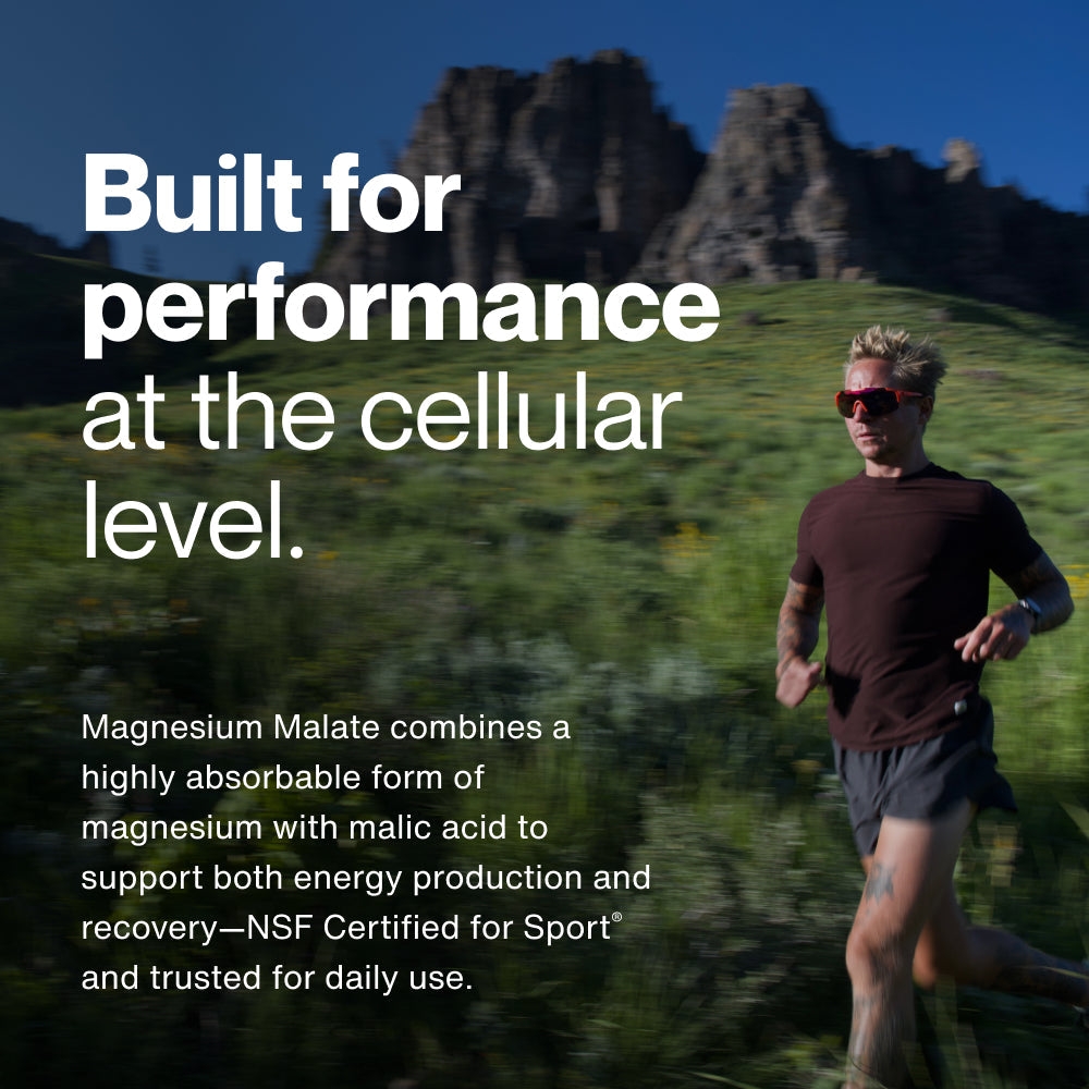 Black bottle of Magnesium Malate dietary supplement capsules designed for muscle recovery and energy, featuring a simple white label with clear text.