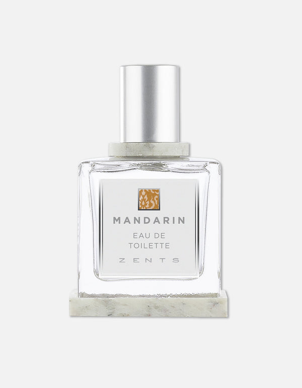 Transparent square glass bottle with a silver cap containing Eau de Toilette | Zents Mandarin fragrance, featuring a minimalist white label and light orange accent.