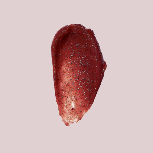 Close-up of a smooth, glittery red skincare product swatch showcasing texture and color for Brightening Mask | Somerset Moss.