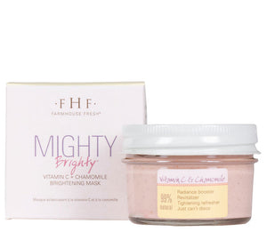 Mighty Brighty™ Vitamin C + Chamomile Brightening Mask | Farmhouse Fresh in a clear jar with a white lid alongside its white and lavender box, promoting radiance and natural skincare benefits.