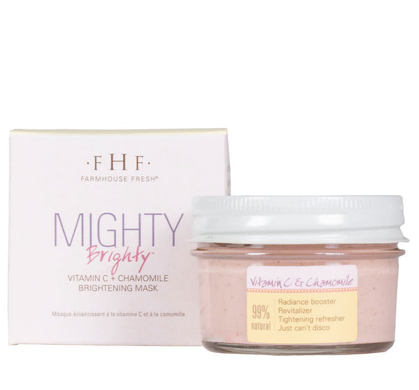 Mighty Brighty™ Vitamin C + Chamomile Brightening Mask | Farmhouse Fresh in a clear jar with a white lid alongside its white and lavender box, promoting radiance and natural skincare benefits.