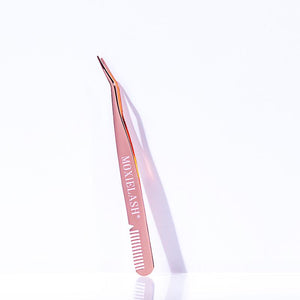 Rose gold lash applicator tool with a curved tip and comb edge, designed for precise eyelash extension application, labeled Lash Applicator - Rose Gold | Moxielash.