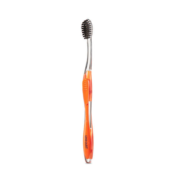 Nano-Silver Toothbrush | LINHART with an ergonomic translucent orange handle and black bristles designed for effective oral care and wellness.