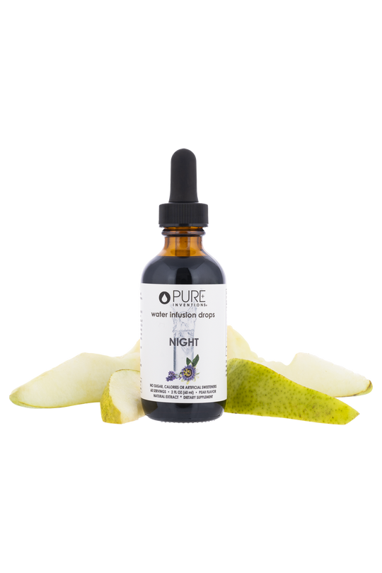 Bottle of Night Water Infusion Drops | Pure Inventions with a dropper lid, surrounded by fresh pear slices, highlighting skincare and wellness supplement benefits.